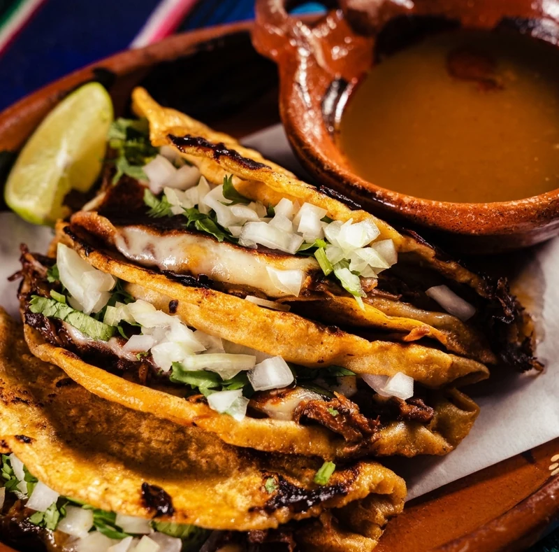 Beef birria taco with consommé for dipping at Casa Azul Mexican restaurant, St. Thomas, Ontario